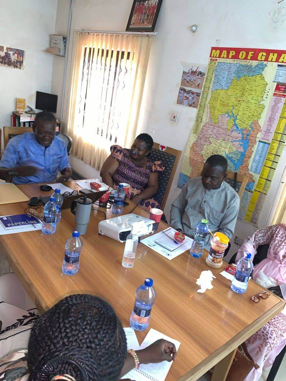 Staff reviewing documents during a Development Frontiers meeting